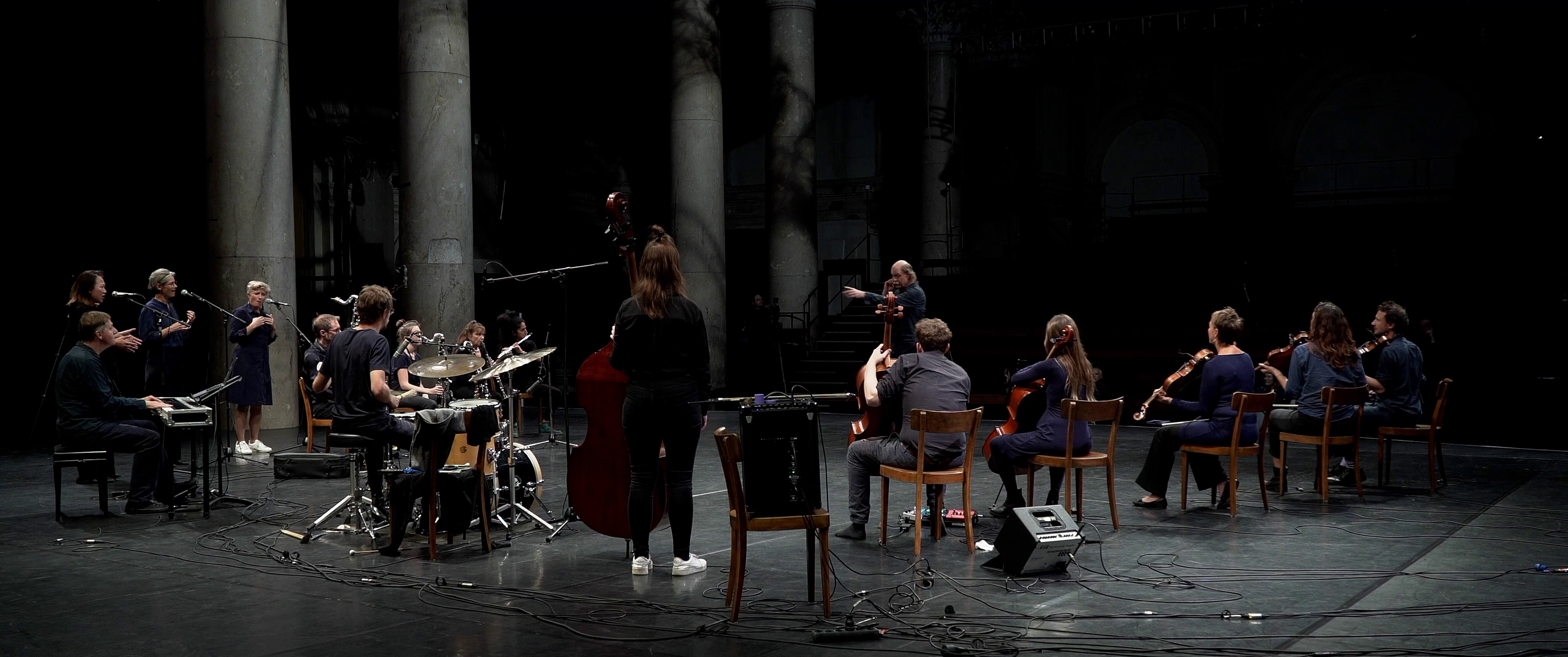 In This Present Space (Still) - by Mersolis Schöne with the Vienna Improvisers Orchestra, Michael Fischer (instant composition conducting), Odeon Theater, Wien, Vienna, Anne Bennent, Isabell Kargl, Sun Sun Yap, Nika Zach, Tahereh Nourani, Elisabeth Kelvin, Lisa Hofmaninger, Clemens Salesny, Florian Sighartner, Emily Stewart, Judith Reiter, Irmi Wolvin, Clemens Sainitzer, Beate Wiesinger, Edward Reardon, Valentin Duit, special thanks to Max Kaufmann and Anne Bennent